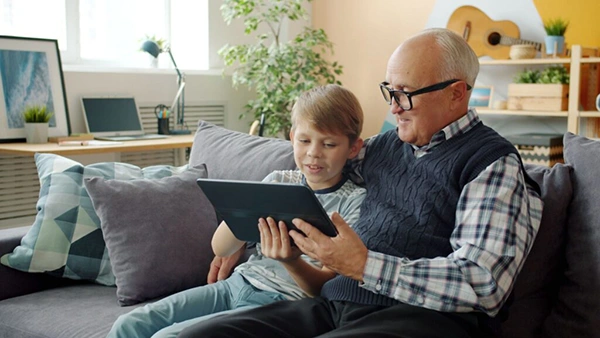 Grandfather and Grandson Sharing Same Tab